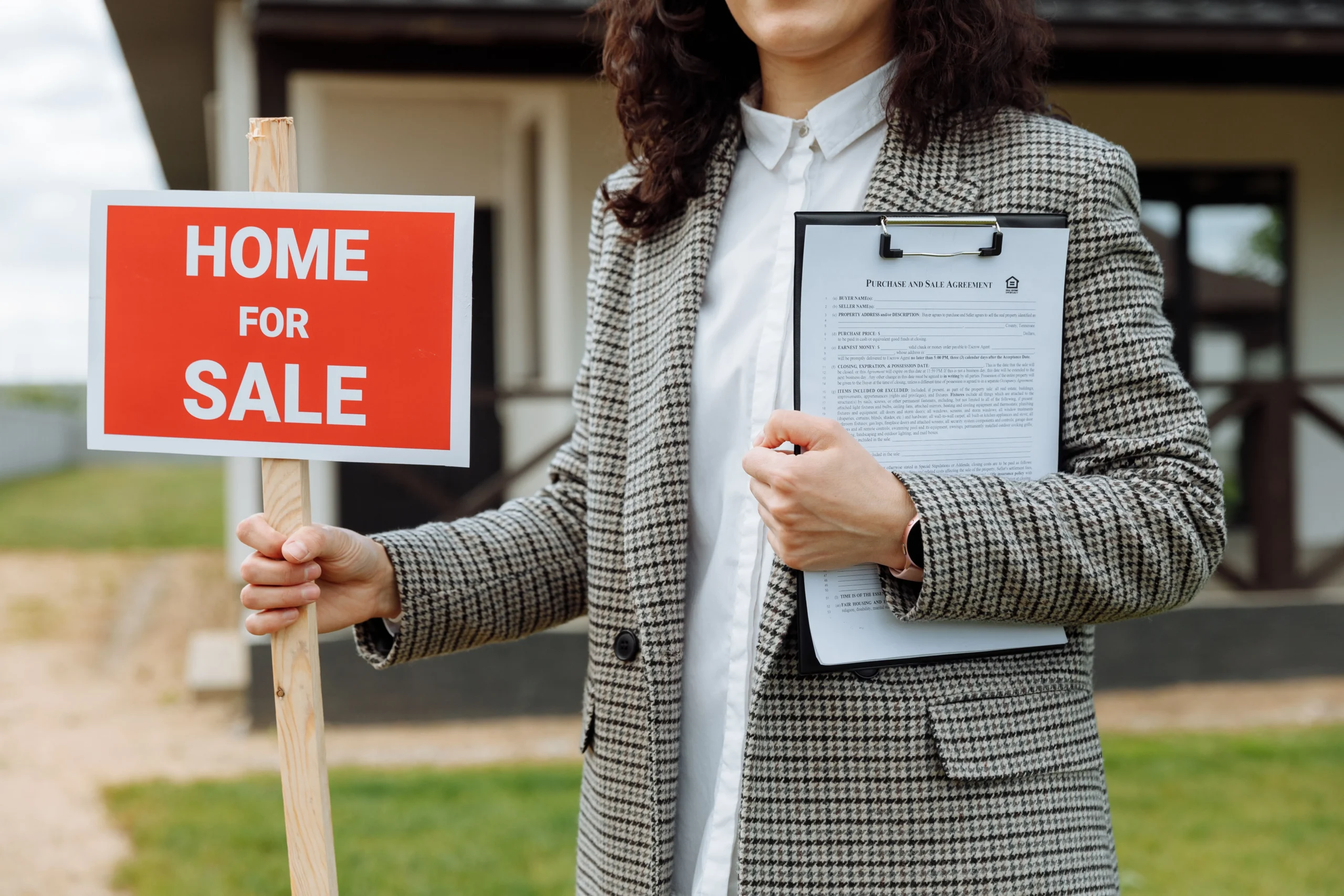 Real estate attorney reviewing Georgia property closing documents and checklist